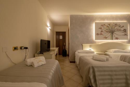 Letto o letti in una camera di Hotel San Lorenzo