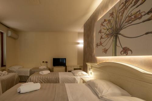 Letto o letti in una camera di Hotel San Lorenzo