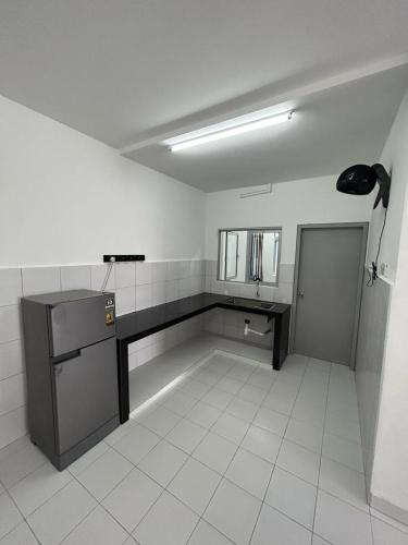 a bathroom with a sink and a counter in a room at Residensi Idaman Cyberjaya in Cyberjaya