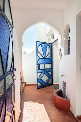 a door in a room with a tile floor at DAR YAMNA Maison typique Kasbah de Tanger in Tangier