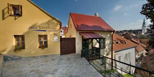 a building with a sign on the side of it at Hotel Joseph 1699 in Třebíč