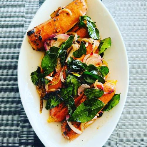a plate of food with a salad on a table at Misty Paradise of Lake Gregory in Nuwara Eliya