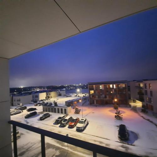 a view of a parking lot at night at SV apartment self check in free parking in Klaipėda