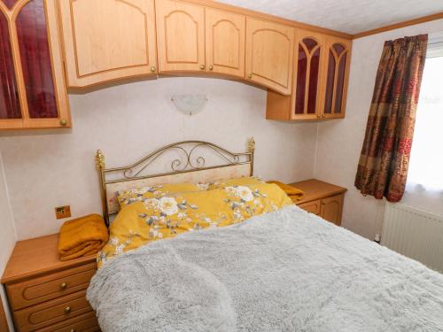 Un pat sau paturi într-o cameră la Park Lane