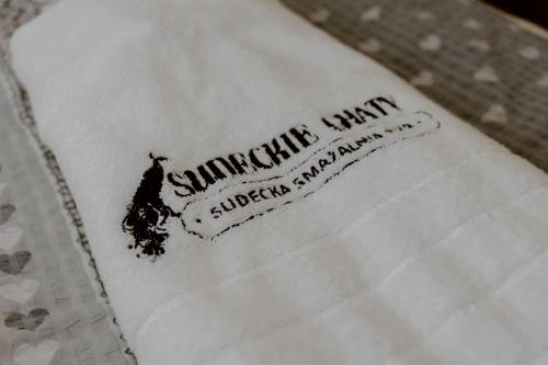 a napkin with the name of a restaurant on it at Sudecki Domek in Kudowa-Zdrój