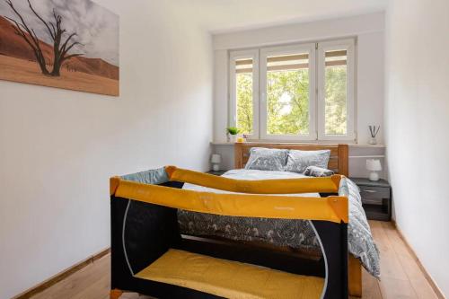 a bedroom with two beds and a window at The Best Location in Cracow for City Break in Kraków