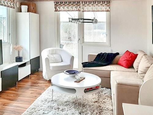 a living room with a couch and a table at 4 person holiday home in TRENSUM-By Traum in Trensum