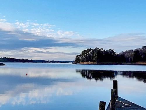 a view of a large lake with a dock at 4 person holiday home in TRENSUM-By Traum in Trensum