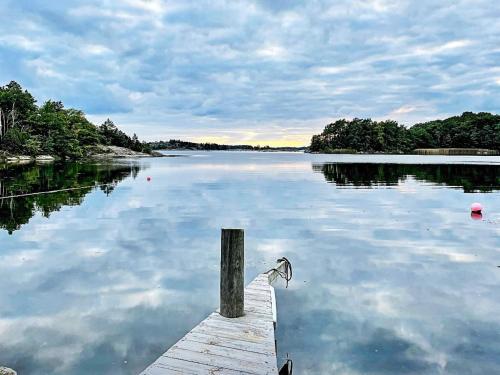 a bird sitting on a dock in the water at 4 person holiday home in TRENSUM-By Traum in Trensum