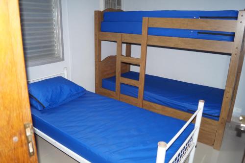 Ein Bett oder Betten in einem Zimmer der Unterkunft Apartamento para alugar - temporada