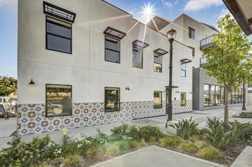 a building with a street light in front of it at Single Bedroom - Queen Size. Heart of Downtown Vista in Vista