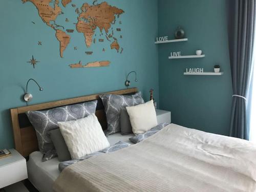 a bedroom with a bed and a world map on the wall at Premium Apartment, Family friendly in Vienna