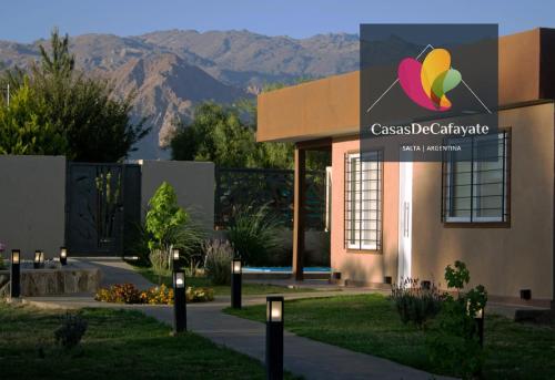 a building with a sign on the side of it at Casas de Cafayate in Cafayate