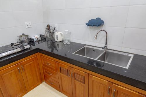 a kitchen with a sink and a counter top at Thủy Loan House Đà Lạt in Da Lat