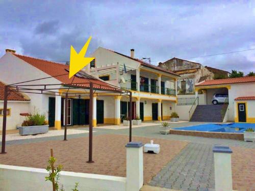 a yellow star on the roof of a house at 4 Persoons Woning met Zwembad. Rustig gelegen. in Figueira e Barros