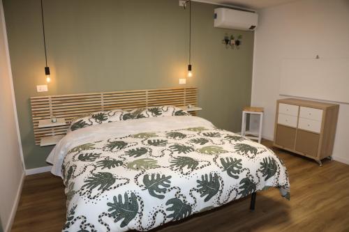 a bedroom with a bed and a wooden floor at Casa Viscardi in Naples