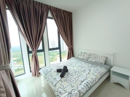 a bed in a room with a large window at Medini Elysia Park , 3 min to Legoland, Netflix By Hint Homestay in Nusajaya
