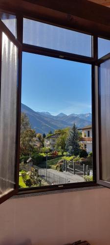 an open window with a view of a street at Casa Vacanze Le tre Sorelle in Torre Pellice