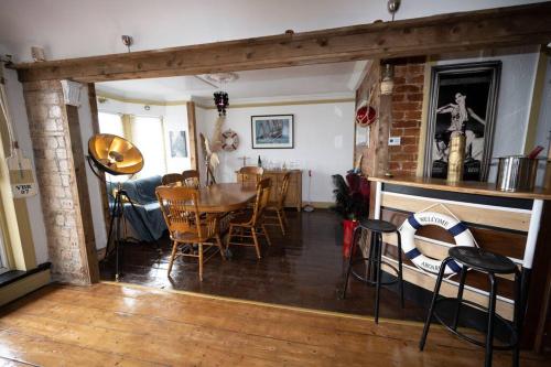 a dining room with a table and chairs at Sunmount in Youghal