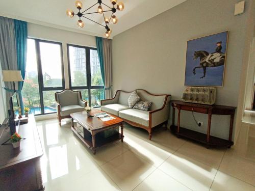 a living room with a couch and a table at Medini Elysia Park , 3 min to Legoland, Netflix By Hint Homestay in Nusajaya