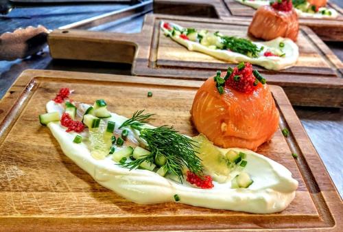 a plate of food with vegetables on a table at The Old Manor House Hotel in Keynsham