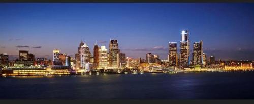 a view of a city skyline at night at Albert Housing in Windsor