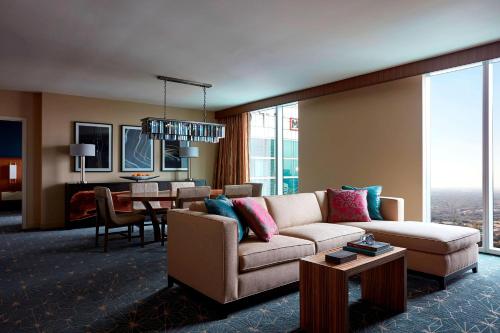 a living room with a couch and a table at Marriott Marquis Houston in Houston