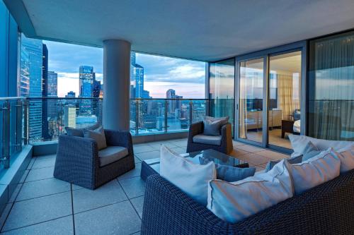 a balcony with chairs and a view of the city at Marriott Marquis Houston in Houston