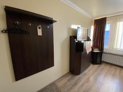 TV a/nebo společenská místnost v ubytování Sting Hotel & Event Palace