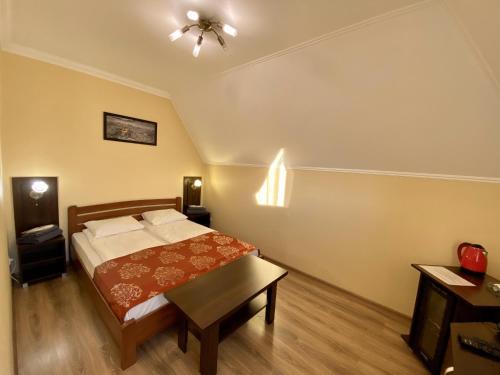 Postel nebo postele na pokoji v ubytování Sting Hotel & Event Palace