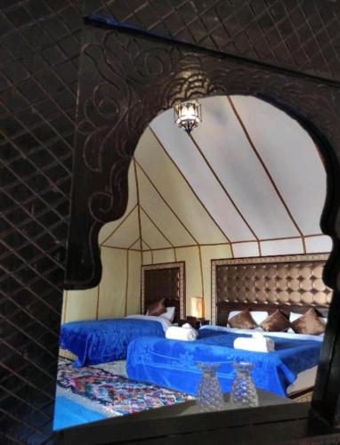 Ένα ή περισσότερα κρεβάτια σε δωμάτιο στο Super Luxury camp