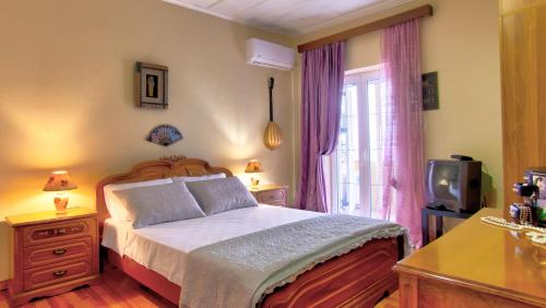 Кровать или кровати в номере Villa Eftichia