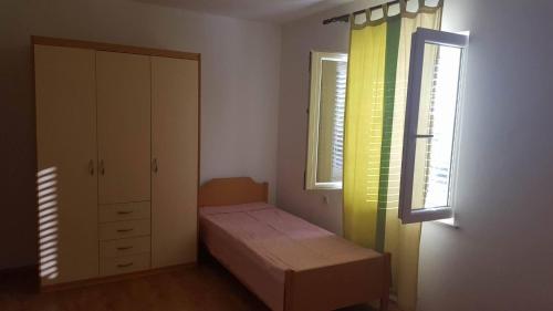Ένα ή περισσότερα κρεβάτια σε δωμάτιο στο Apartments Luka