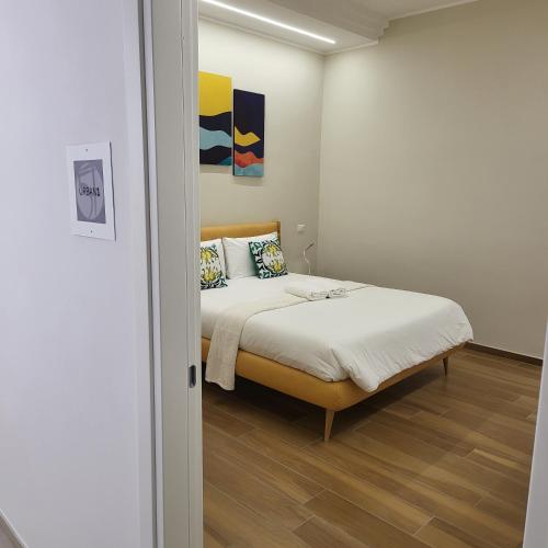 Postel nebo postele na pokoji v ubytování B&B Salerno Urban Suite 57