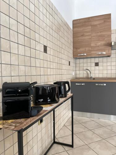 a kitchen with two microwaves on a counter at Santa Maria Home in Naples