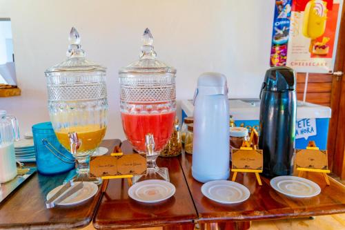 a table with two glass blenders on top of a counter at Pousada Coco Cabana in Camocim