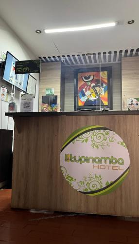 a counter in a store with a sign on it at Hotel Tupinamba Neiva in Neiva