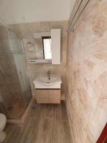 a bathroom with a sink and a shower at Giovanni Apartments Kos Studio 20 in Kos