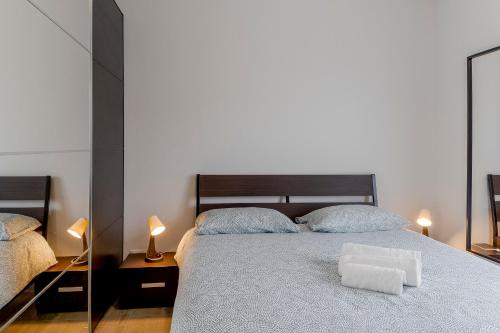 a bedroom with a bed with a white pillow on it at Il Gattino di Porto - apt 5 - Bilocale terrazzo piscina in Imperia