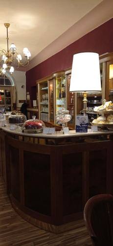 a bar with a light on top of it at Hotel U Zlateho jelena in Prague