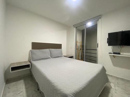 Postelja oz. postelje v sobi nastanitve Apartamento amoblado al norte de Armenia