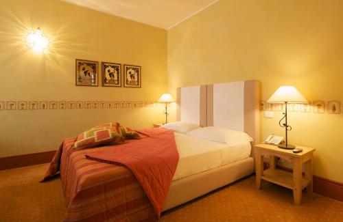 a hotel room with a bed and a telephone at A Casa Di Paola in Chiarano