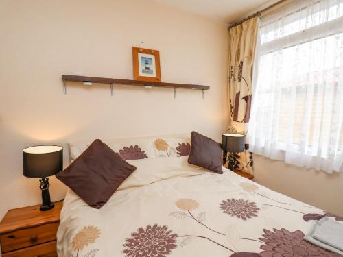 En eller flere senge i et værelse på 225 Seaside Retreat