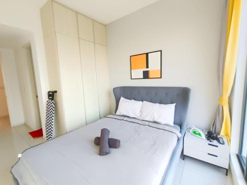 a small bedroom with a bed and a yellow curtain at Medini Elysia Park , 3 min to Legoland, Netflix By Hint Homestay in Nusajaya