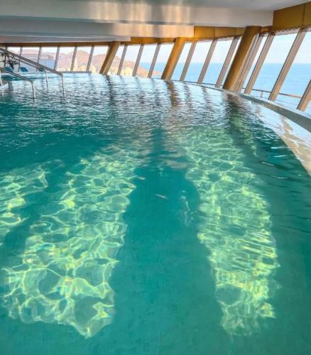 a swimming pool on a cruise ship at Intempo privat luxury apartment & spa in Benidorm