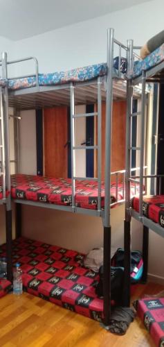 a room with three bunk beds in a room at bed space for weekly with other guests in Dubai