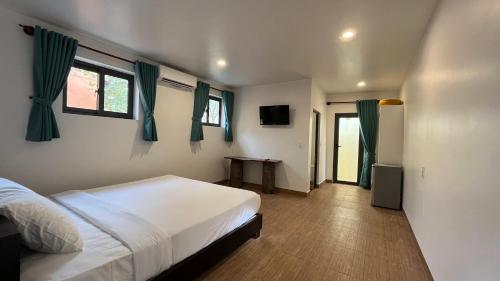 Postel nebo postele na pokoji v ubytování Mi Nhon Em Hotel Muine