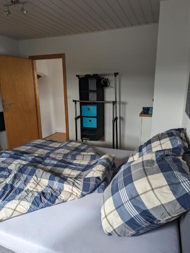 a bedroom with a bed with two pillows on it at Pension Larifari in Drees