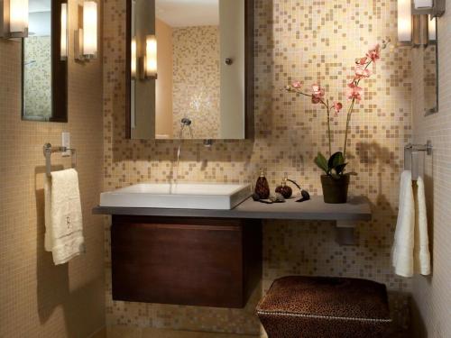 a bathroom with a sink and a mirror at Royal Comfort Cottage, Panipat in Pānīpat