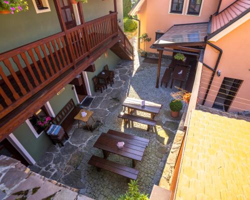 an overhead view of a patio with benches and tables at Penzion Tilia in Český Krumlov